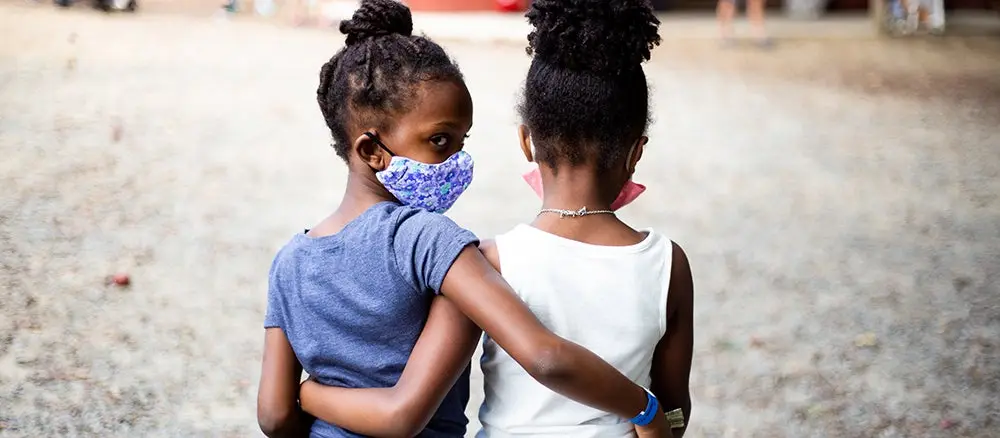 Diverse family embracing